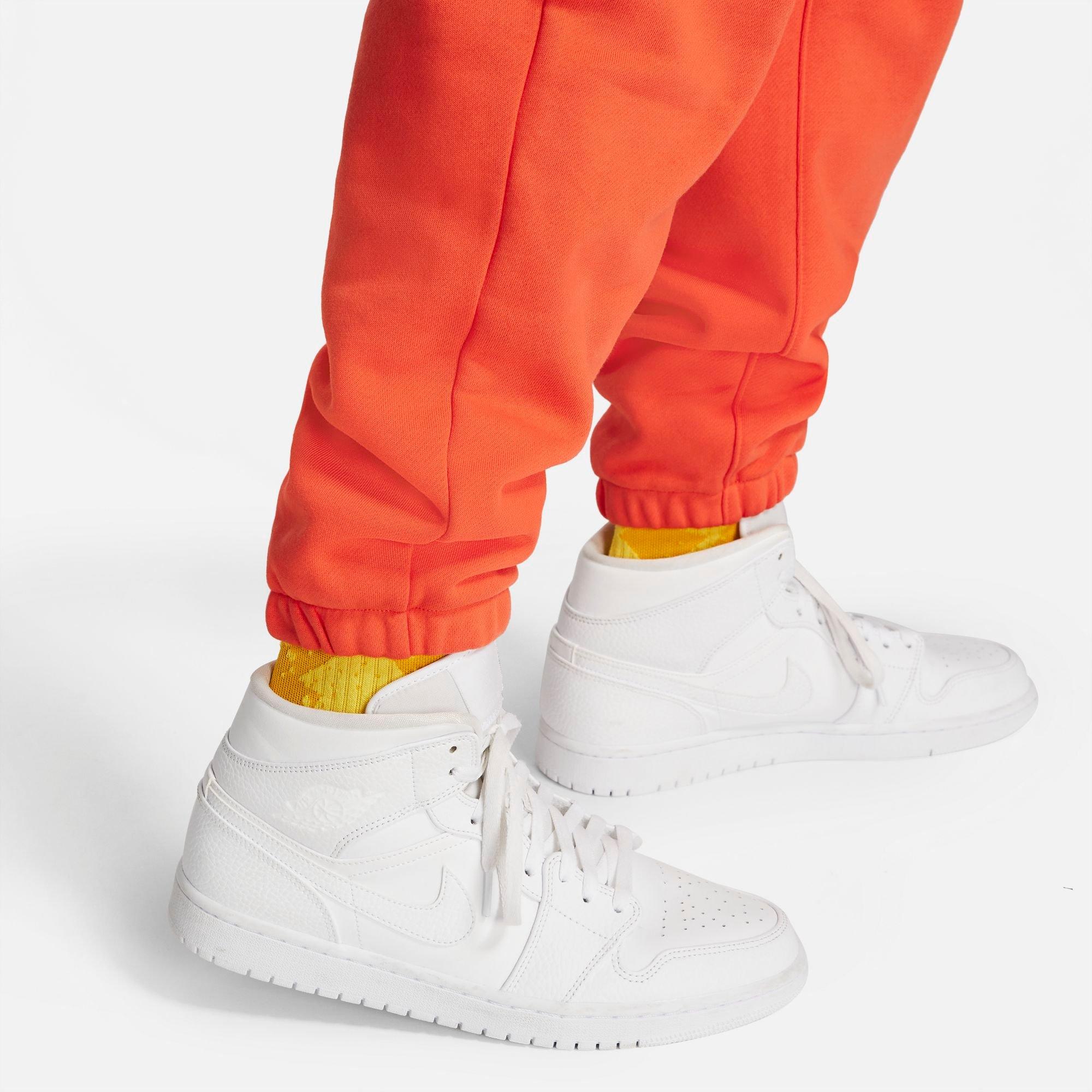 Jordans with orange on sale bottoms